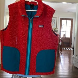Youth size 10 Patagonia Vest. Excellent condition. Burnt Orange with teal trim.